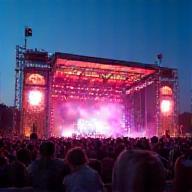 Outdoor event with stage and crowd